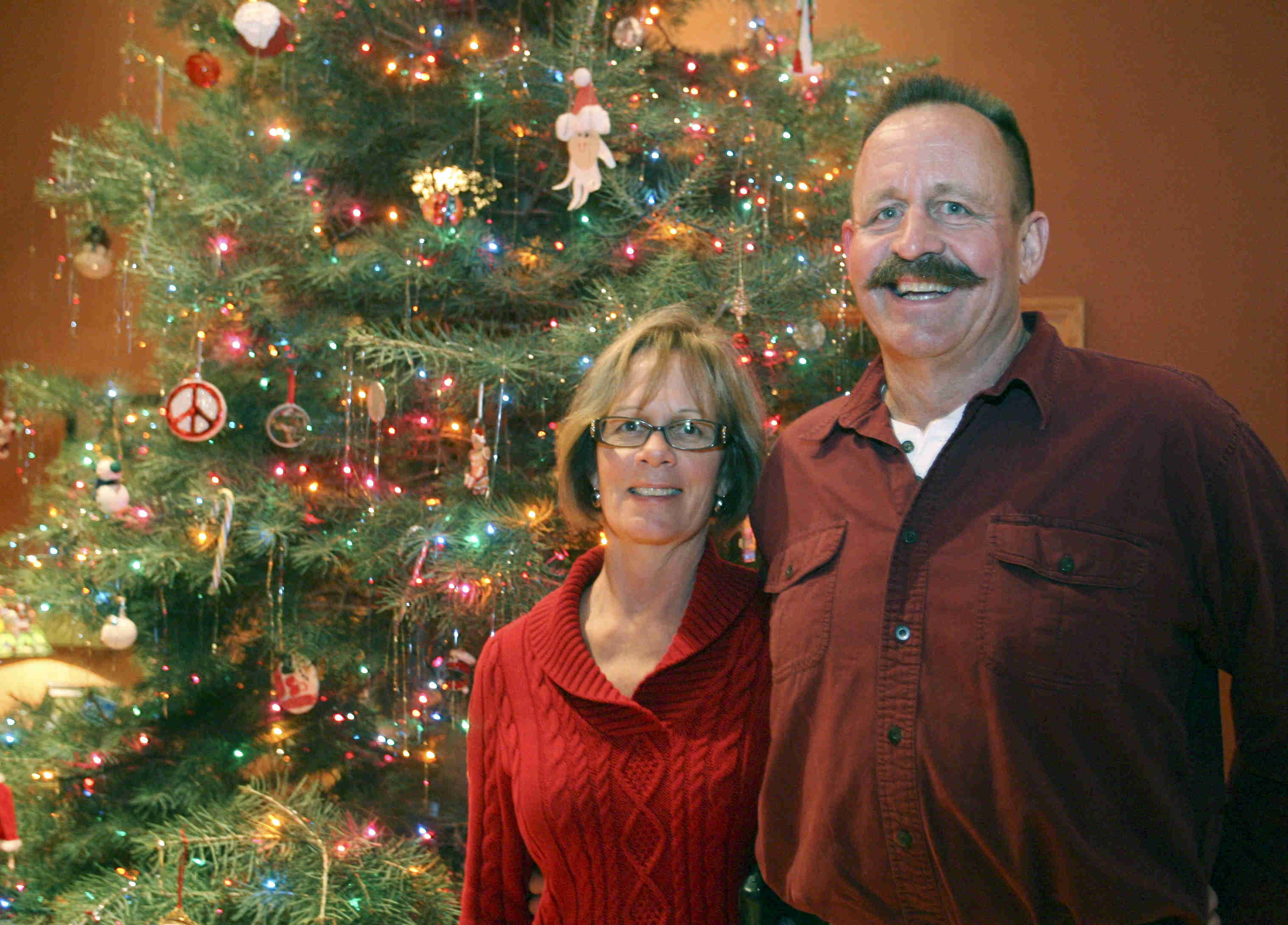 JESSICA M. KANALAS | THE VINDICATOR 
Paula and Frank Dietz show off their 18-foot Christmas tree. The couple always buy a large tree, but this year’s is the tallest.