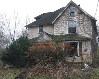 Officials found five dogs and a dogfighting setup inside this abandoned West Myrtle Avenue home on Youngstown’s South Side earlier this week. Three of the dogs are in the care of the county dog warden, but two were missing when officials went to remove