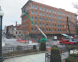 Construction work progresses on the Erie Terminal building, a $9 million, 65-person residential complex that will be the latest, biggest brick in a critical bridge between downtown and the Youngstown State University campus. Dominic Marchionda and his wife, Jackie, are spearheading the project.