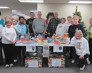 Members of the Austintown Senior Center, shown above, recently sent care packages to three Mahoning County soldiers. Items included games, cards, snacks and personal hygiene items.