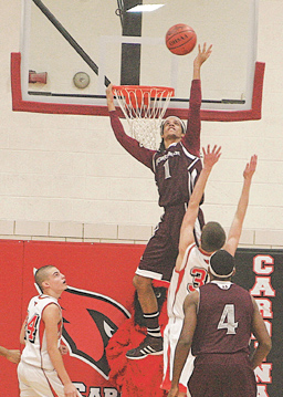 Boardman’s Dayne Hammond (1) goes for a slam during Tuesday’s game at Canfield.