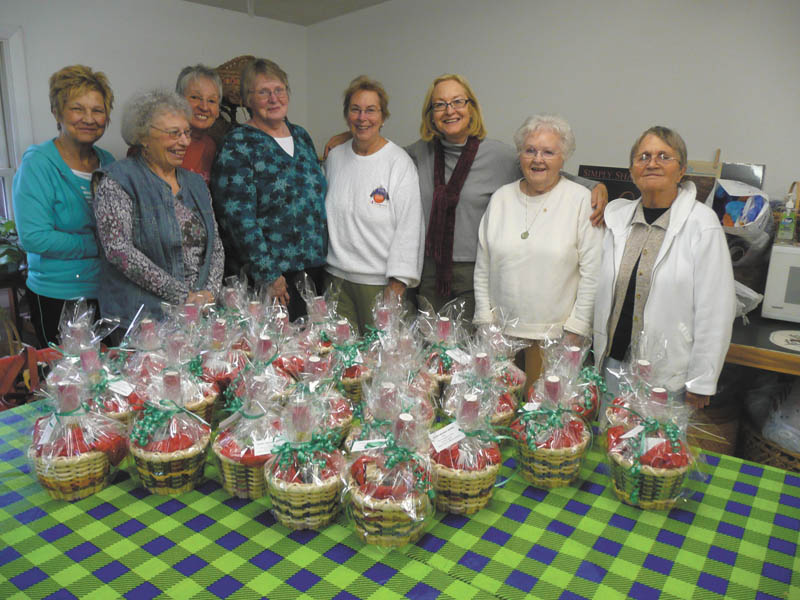 Members of the Youngstown Area Weavers Guild met recently to make baskets for the needy. The hand-woven creations were then filled with personal care items and donated to The Way Station in Columbiana County. Members who helped with the project, left to right: Nancy Marshall; Sally Macklin; Lois Romito; Nina Winchester; Liz Andrazo, guild president; Carolyn Furnish; Mary Furguson; and Felicia MacMillan. The guild also collected gloves and hats for various charities and toys for the local Toys for Tots campaign.