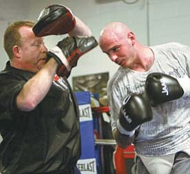 Kelly Pavlik practices for a May bout with his former trainer Jack Loew. Late in 2011, Loew and Pavlik parted ways. Pavlik ended the year facing three charges, including operating a vehicle impaired.