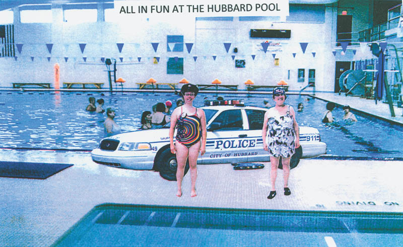 Eugene Magalotti of Brookfield trained as a combat photographer while serving in the U.S. Marine Corps in 1949. Now he likes to take pictures of his friends at the Hubbard Community Pool and uses his training to manipulate the photos into funny poses. He says Chief of Police Elizabeth Curtain, left, and Officer Liz Prelac, right, serve with the Water Police.