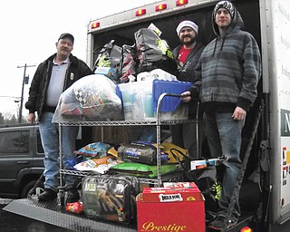 Operation “Santa Paws” is an annual Christmas drive spearheaded by Shepherd of the Valley-Poland that provides donations to Animal Welfare League of Trumbull County, Animal Charity in Youngstown and Alchemy Acres Animal Sanctuary in Salem. Now in its fourth year, the donations, collected at various locations, far exceeded those of past years. Drop-off points included Southern Park Mall, Copper Zone Tanning and Pet Lodge in Boardman, and Roth Bros. selected the drive as its charity of choice this year. In addition to pet food and supplies, $240 was donated, which was divided among the three agencies. Shown, left to right, are Ken Herlinger of AWL; Donnie Fatou, Shepherd of the Valley materials management clerk; and Andrew Austin, AWL.