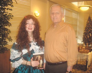 Actress and author Carol Weakland, left, and Tony Cebriak discuss her recent presentation of “The Cricket on the Hearth,” a lesser-known Christmas tale by Charles Dickens, to the Austintown Friends of the Library. The next Friends’ meeting will be at 10 a.m. Jan. 23 at the library, one week later than usual due to the Martin Luther King Day closing. The speaker will be Loretta Ekoniak, who will share information on the Slovak heritage in the Mahoning Valley. Meetings are open to the public and refreshments will be served.