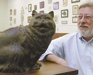 Fred Pisani, manager of the Feline Historical Museum in Alliance, oversees a collection of art and pop-culture items involving cats.