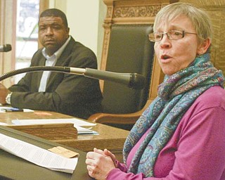 Susie Beiersdorfer, a part-time geology instructor at Youngstown State University and a member of Occupy Youngstown, spoke at Wednesday’s city council meeting about injection wells and earthquakes. Council President Jamael Tito Brown, left, listens.