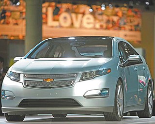 The 2011 Chevrolet Volt debuts at the Los Angeles Auto Show in Los Angeles. General Motors will strengthen the structure around the batteries in its Volt electric cars to keep them safe during crashes, a person briefed on the matter said Thursday.