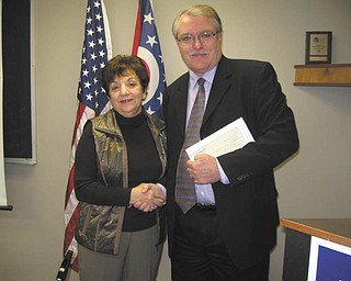 Easter Seals is beneficiary: MTC Easter Seals and Youngstown Hearing & Speech Center was recently presented with a check from the Youngstown-Columbiana Association of Realtors in the amount of $7,300. Ken Sklenar, right, president and chief executive of the recently merged organization, accepts the donation from Joan Zarlenga, 2011 YCAR president. Each year YCAR chooses a charitable organization to be the recipient of funds raised through annual dues, educational classes and 50-50 raffles at each of their meetings.