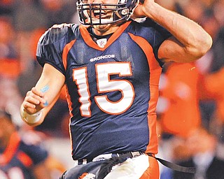Denver quarterback Tim Tebow celebrates his 80-yard touchdown pass in overtime, giving the Broncos a 29-23 win over the Steelers in an NFL wild card playoff game Sunday in Denver.
