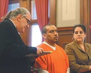 State-certifi ed English-Spanish interpreter John P. Shaklee, left, interprets for Victor Manuel Galindo-Barjas, a native Spanishspeaker from Mexico, during a court hearing in which Barjas pleaded guilty to drunken driving and two counts of aggravated vehicular assault. At right is Barjas’ lawyer, Miriam Ocasio. Costs for interpreters have been low. A5.