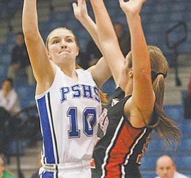 Canfield’s Kayla Barko (12) pressures Poland’s Aleah Hughes (10) as she tries to shoot the ball during the
second period of their All-American Conference basketball game Thursday in Poland. The Cardinals defeated
the Bulldogs, 56-46.