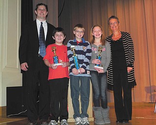 Spelling Bee winners: Roosevelt Elementary School in McDonald had its 2012 Spelling Bee on Jan. 11 at McDonald High School. Principal Dave Vecchione, left, stands with students who finished in top spots. From left to right are Jared Helco, third place; Braden Rupe, first place; and Abbie Matig, second place. Spelling Bee instructor Martha Justice is at far right. This is the second consecutive year that Braden has finished in first place.