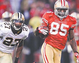 A touchdown by tight end Vernon Davis (85) in the fi nals seconds of the NFC Divisional game against the New Orleans Saints on Sunday got San Francisco into the NFC Championship this Sunday. The loss by Green Bay Packers to the New York Giants means the 49ers get to stay in the much-warmer friendlier Bay area when they play host to the Giants.