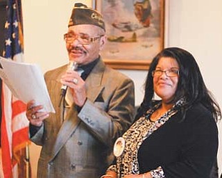 Earl McAlway, left, chaplain of VFW Post 6488, presented the post’s Trailblazer Award to retired Detective Sgt. Delphine Baldwin-Casey, formerly of the Youngstown Police Department. The award was presented Monday in recognition of Baldwin-Casey’s 31 years of service to the Valley at the post in Youngstown.