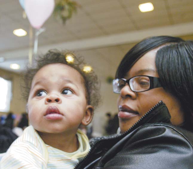 Kayden Smith, 6 months, takes in the scene during the sixth annual citywide baby shower on Monday at the McGuffey Centre. He was with his aunt, Kelley Ray of Youngstown.