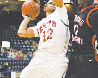 Struthers’ Tommy Kimborough (12) is met by heavy pressure from Erie Strong Vincent’s Denzel Jones (11) during their basketball game Monday during the See Them Rise Classic at the Covelli Centre. The Wildcats came up short against the Colonels, losing 62-60.