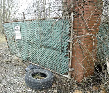 A “No Dumping” sign stands at the contaminated site of the former Ohio Leather Co. property off U.S. Route 422 in Girard. After more than a decade of negotiations with the owners, the city decided Tuesday to obtain the land via foreclosure procedures.