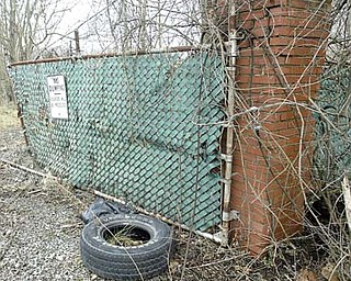 A “No Dumping” sign stands at the contaminated site of the former Ohio Leather Co. property off U.S. Route 422 in Girard. After more than a decade of negotiations with the owners, the city decided Tuesday to obtain the land via foreclosure procedures.