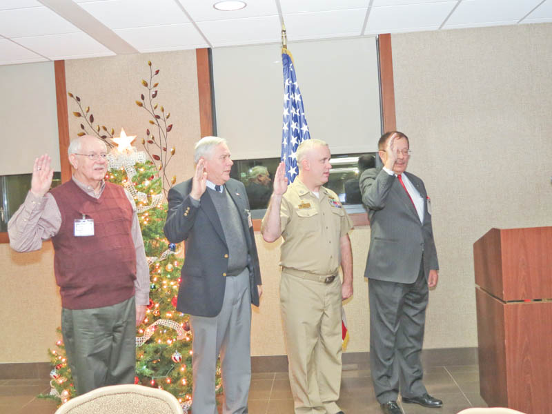New officers of the Mahoning and Shenango Valleys Chapter of Military Officers Association of America take their oath of office in the newly formed chapter headquarters. From left to right are retired Chief Warrant Officer 3rd Class Don Oglesby, secretary/treasurer; retired Lt. Col. Donald Rasile, second vice president; Lt. John Holzer, first vice president; and retired Col. Walter Duzzny, president.