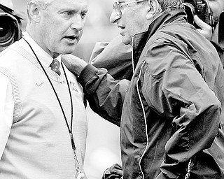 In this Sept. 23, 2006 file photo, Ohio State head coach Jim Tressel, left, and Penn State head coach Joe Paterno meet on the field before an NCAA college football game at Ohio Stadium in Columbus, Ohio. The Two schools meet on Saturday, Oct. 25, 2008 in Columbus. (AP Photo/Kiichiro Sato, File)