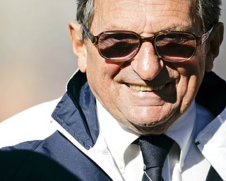 Penn State coach Joe Paterno smiles as he walks the field during warmups before their college football game against Purdue in State College, Pa., Saturday, Nov. 3, 2007. (AP Photo/Carolyn Kaster)