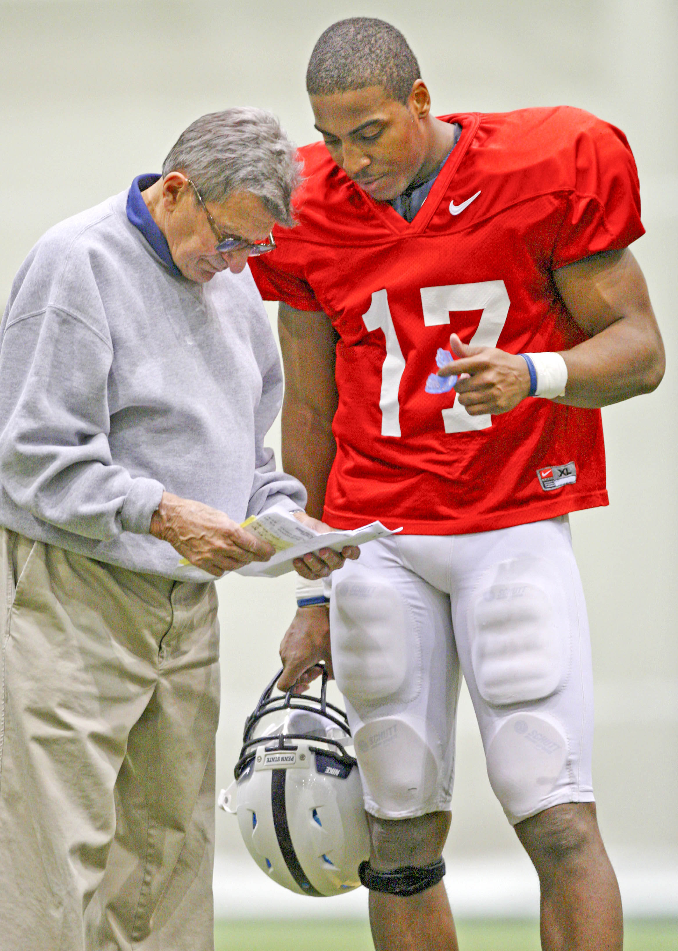 Penn State coach Joe Paterno, left,  talks with quarterback Daryll Clark during a football practice in State College, Pa., Saturday, March 29, 2008. (AP Photo/Carolyn Kaster)