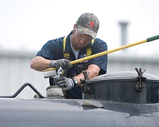 Patriot Water Treatment LLC, the state’s lone brine-wastewater treatment plant in Warren, continues to stave off a potential closing by state environmental regulators. Joe Allen, above, is one of 25 employees at the facility, which currently is running at one-sixth of its capacity.