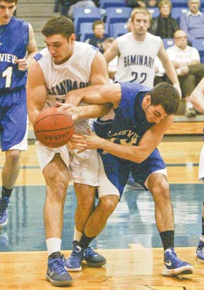 Poland’s Eddie Moore, left, fights for the ball with Lakeview’s Louie Novakovich during first-half action
Tuesday at Poland.