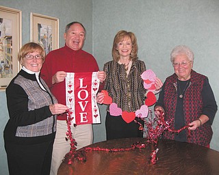 Decorating for dinner: Eileen and Ray Novotny, left, Joan Sonnett and Sister Nancy Dawson, right, general superior of the Ursuline Sisters of Youngstown, ready decorations for the Ursuline Center’s annual Valentine’s Day dinner scheduled for 6:30 p.m. Feb. 14 in the center’s auditorium, 4280 Shields Road, Canfield. Entertainment will be offered by the Canfield High School Music Trio. Tickets are $20, and proceeds will benefit various ministries offered by the Ursuline Sisters. For tickets or more information, call Peggy Eicher at 330-533-7681 or e-mail her at peggyeicher@gmail.com.