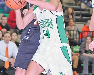 West Branch’s Rebekah Zets (24) puts up a shot and is fouled by Marlington’s Malea Stuffel during Wednesday’s
game in Beloit. West Branch won 56-47.