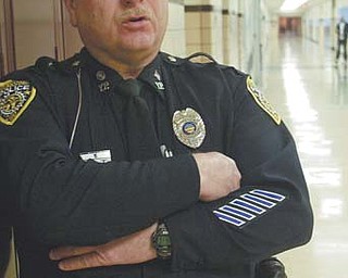 Youngstown Police Department Patrolman Richard Baldwin is shown in a hallway at Chaney High School, where he works as a security officer two days a week. The Ohio Veterans of Foreign Wars named Baldwin its Law Enforcement Officer of the Year. He will receive the award Saturday at the VFW’s Mid-Year Conference in
Columbus.
