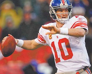 New York Giants quarterback Eli Manning throws during the first half of the NFC Championship against the San Francisco 49ers in San Francisco.