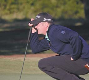 Warren JFK graduate Jason Kokrak lines up a putt during the Nationwide Tour Championship in Charleston,
S.C.