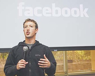 Facebook CEO Mark Zuckerberg talks about the social-networking site’s new privacy settings in Palo Alto, Calif. Facebook filed Wednesday to sell stock on the open market in what is the most talked-about initial public
offering since Google in 2004.