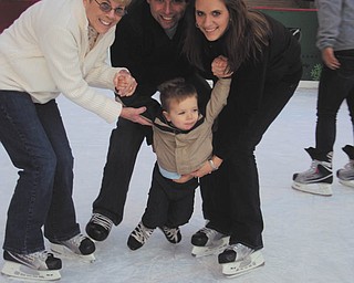 Evan Dunn, a first-time skater at 22 months, gets a little help from his parents, Jamie and Kelly Dunn of Tempe, Ariz., (formerly of Liberty and Canfield) and his Gran, Lynn Dunn of Liberty. Photo was taken by Evan's Papa, Dave Dunn. Evan is also the grandson of Bob and Eileen Leonard of Canfield.