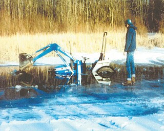 Twenty years ago, Frank Hoffman of North Lima was clearing off his neighbor's pond so his children could ice-skate. The pond was frozen, except for one edge. The ice began to crack and Frank's brand-new tractor began to sink, much to his horror. Photo submitted by Frank's wife, Victoria Hoffman.