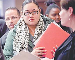 People wait to talk with potential employers at a job fair sponsored by National Career Fairs in New York. Month by month, the U.S. job market is regaining its health.