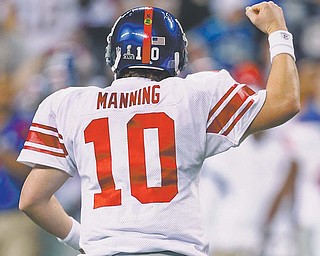 New York Giants quarterback Eli Manning celebrates after throwing a touchdown pass against the New England Patriots during Super Bowl XLVI on Sunday at Lucas Oil Stadium in Indianapolis. The Giants defeated the Patriots, 21-17, for a second time in a Super Bowl, with Manning guiding them on an 88-yard drive that ended in a touchdown by running back Ahmed Bradshaw late in the fourth quarter and earned Manning MVP honors.