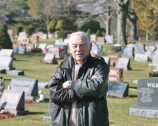Ted Heineman, Poland Cemetery Association secretary, stands in Riverside Cemetery. Two drilling companies have asked about leasing mineral rights, and the association is reviewing two contracts from interested oil and natural-gas drilling companies.