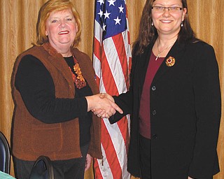 Dem women elect new president: Outgoing president Kathy Cardille, left, congratulates Missa Eaton on becoming the newly elected president of the Democratic Women of Mercer County. Eaton, a charter member of the organization, assumed her duties Jan. 21 at the DWMC-sponsored “Party for the Party” in Hermitage, Pa.
