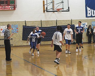 Fairhaven School student Jason Kirksey takes the ball down the court during the first Winter Classic charity basketball game between the Fairhaven School Bulldogs and the Girard High School Indians. The unified format game took place on Jan. 23 at Fairhaven School in Niles and was viewed by students, staff and parents. Cheered on by cheerleaders from both schools, the Girard boys and girls varsity teams and pep band participated in the event, which was coordinated by Girard Principal William Ryser and Carol Kirsch, APE instructor at Fairhaven. After the game, students and staff shared a luncheon donated by Leo’s Ristoranté of Howland.