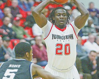 Youngstown State’s Nate Perry shoots past Butler’s Ronald Nored during a game last season at YSU’s Beeghly Center. The Penguins lost to the Bulldogs on the road in January at Hinkle Fieldhouse in Indianapolis, but they are looking to even the series tonight when Butler returns to Beeghly.