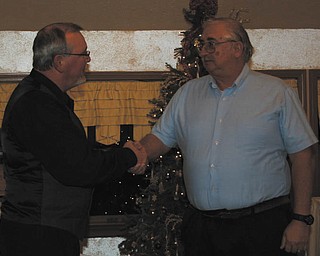 Wayne Holton, left, zone governor of the Berlin Ellsworth Ruritan Club, welcomed the group’s newest member, Walter Overly, on Dec. 12 at A la Cart Catering in Canfield. Overly is a retired technician and has lived in Berlin Center for 19 years. He also is a member of the Berlin Center Crime Watch.