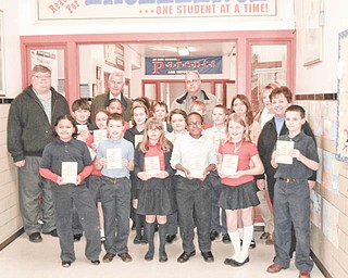 Each year, Struthers Rotary donates dictionaries to fourth grade students in Struthers, Campbell and Lowellville. The goal of the Rotary “Dictionary Project” is to assist students to become good writers, active readers, creative thinkers and resourceful learners. Students at St. Nicholas Elementary School in Struthers are shown with Rotarians, from left, Mike Evanson, Dan Becker, Tom Baringer and Marge Diorio. Fourth-grade teacher Mary Jo Nyers is at far right.