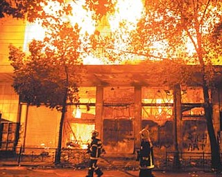 A cinema burns in Athens, Greece, on Sunday. Riots engulfed Athens, and at least 10 buildings went up in
flames in mass protests late Sunday as lawmakers prepared for a historic parliamentary vote on harsh austerity measures demanded to keep the country solvent and within the eurozone.