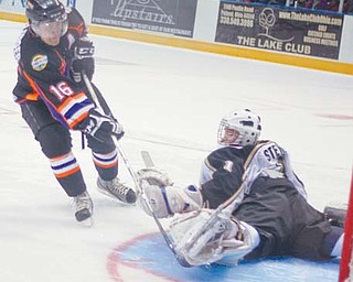 The Youngstown Phantoms’ Ryan Belonger (16) scores on Muskegon goaltender Hayden Stewart during a shootout at Sunday’s game at the Covelli Centre. The Phantoms fell 4-3.