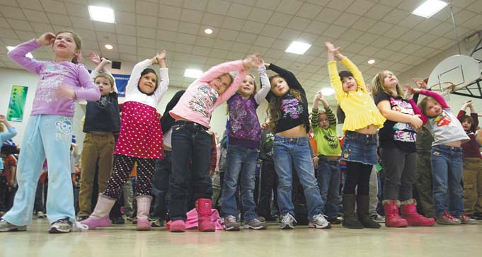Poland Union Elementary students stretch and dance Wednesday during a Radio Disney dance party. Union is one of 20 schools in Ohio to win the “Anthem Blue Cross and Blue Shield Get Active, Get Fit School Challenge” sponsored by Radio Disney.