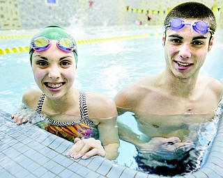 Cardinal Mooney swimmers Annie and Joe Boniface practice in the pool at the YMCA in Youngstown. The Cardinals did not have a swim team until eight years ago when the siblings’ older brother Tom proposed the idea.